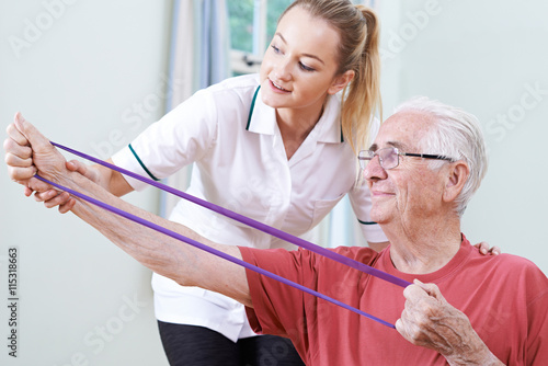 Senior Male Working With Physiotherapist