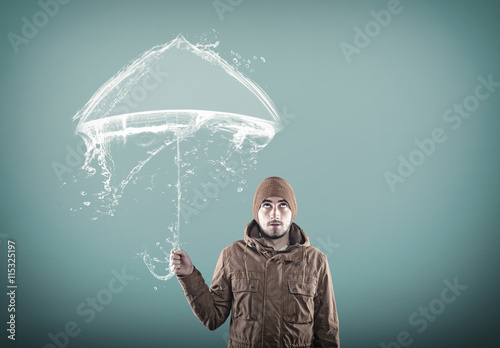 Young man under an umbrella