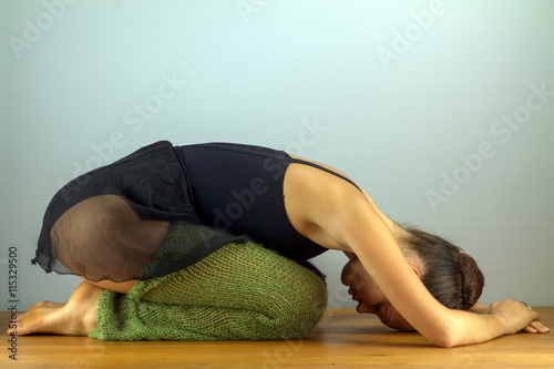 female dancer doing stretching for the back