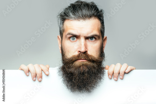 bearded surprised man with paper