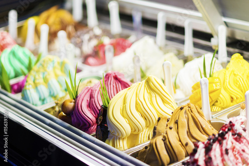 mixed colourful gourmet ice cream sweet gelato in shop display
