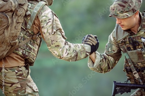 rangers during the military operation. soldiers climbing on mountain