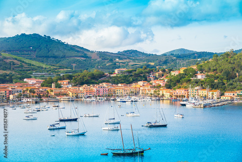 Beautiful panoramic view over Porto Azzurro village at sunset, in Elba island, Italy