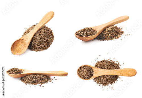 Wooden spoon over the pile of cumin