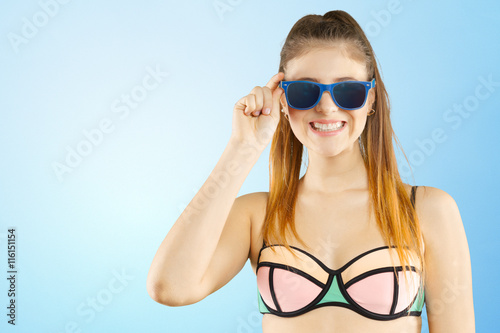 Portrait of a beautiful young woman posing in bikini