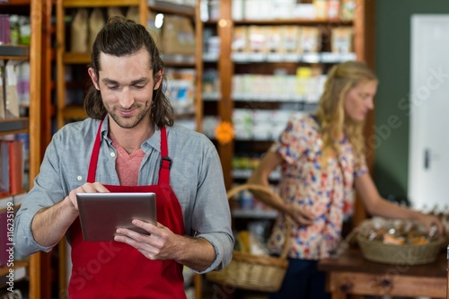 Male staff using a digital tablet