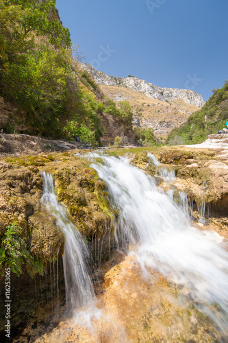 The natural reserve Cavagrande, Sicily, with a view of a smal fall and of the canyon