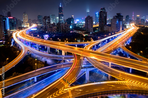 Shanghai elevated road junction and interchange overpass at night, Shanghai China