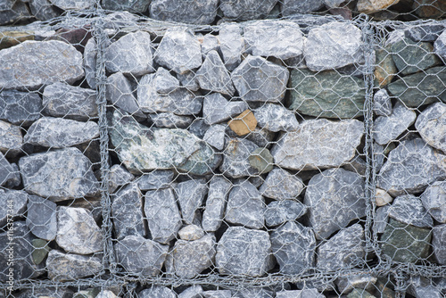 Stone walls in net prevent landslides