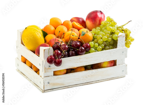 Wooden box with different fruits