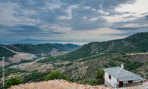 Blue hour over the village of Kastro, Thassos, Greece - view towards the mount Atos in the distance