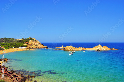 Pregonda beach in Menorca island in July (Spain)