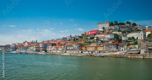 Old town cityscape on the Douro River with traditional Rabelo boats in Porto, Portugal