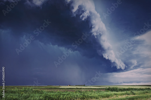 Storm Clouds over planted fields in Vojvodina, Serbia, copyspace included 