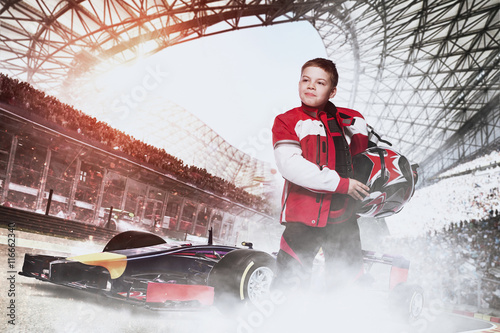 boy racer with race car at the stadium