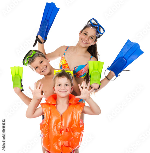 Three happy kids in diving mask standing together