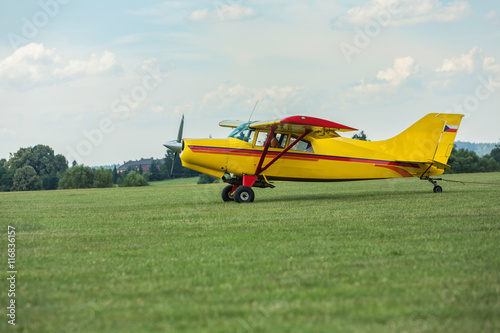 Towing aircraft on a grassy airport ready for takeoff