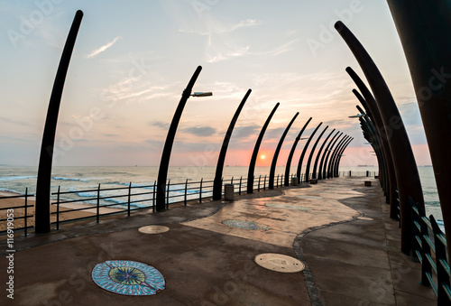 View of ships on Indian Ocean through the Millenium Pier in Umhlanga Rocks at sunrise