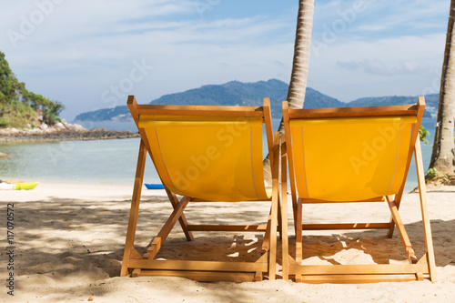 summer beach sun chairs lounger near tropical sea