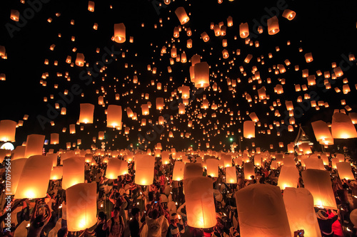 CHIANG MAI, THAILAND - NOVEMBER 8, 2014: Visitors are launching colorful lanterns in Loykratong festival at Chiangmai, Thailand.