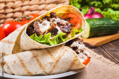 Tasty fresh wrap sandwich with beef and vegetables