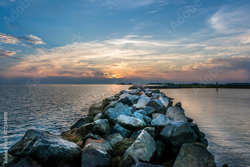 Sunset over a rock jetty on the Chesapeake Bay