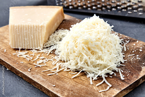 Piece of a parmesan and grated cheese