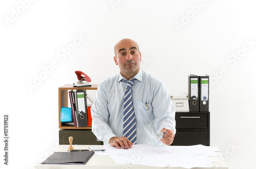 Slacker bureaucrat in office overworked with documents