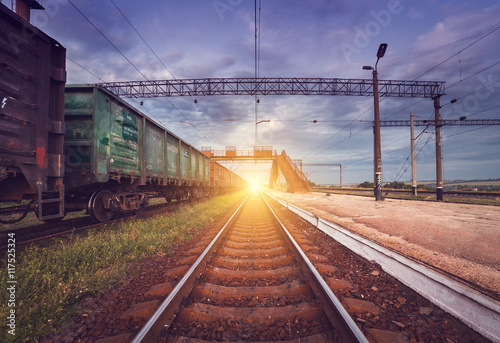 Cargo train platform at sunset. Railroad in Ukraine. Railway sta