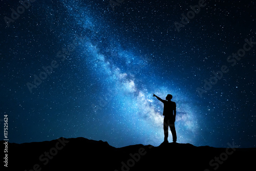 Night landscape with Milky Way and silhouette of a man