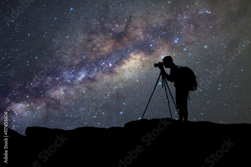 silhouette of man photography take a photo of Milky Way galaxy