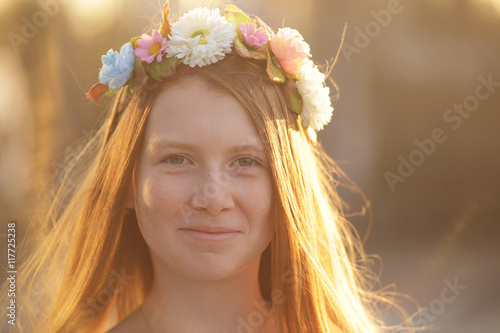 Red hair Girl Portrait in circlet of flowers