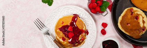 Pancakes with Raspberry Sauce for breakfast. Selective focus.