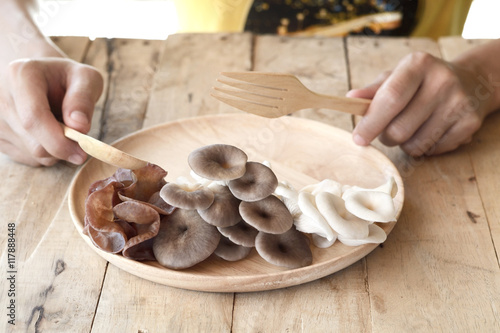 woman eating different edible mushroom