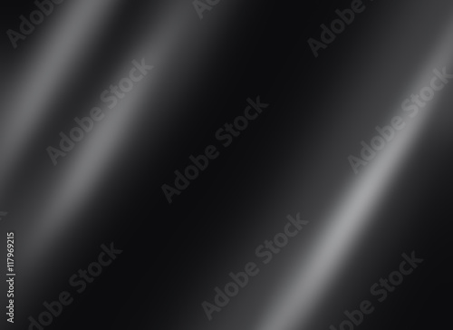 Black shiny metal sheet dark background texture with a copy space for your text.