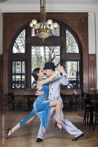 Passionate Tango Dancers Performing In Restaurant