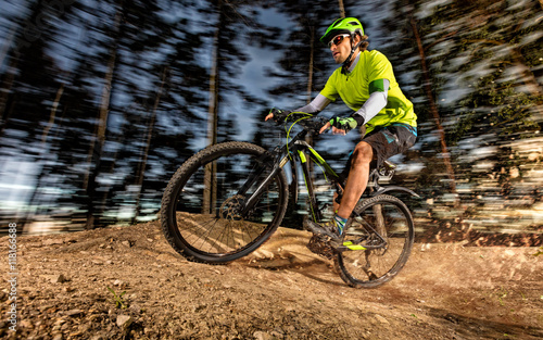 Low angle view of mountain biker riding on trail