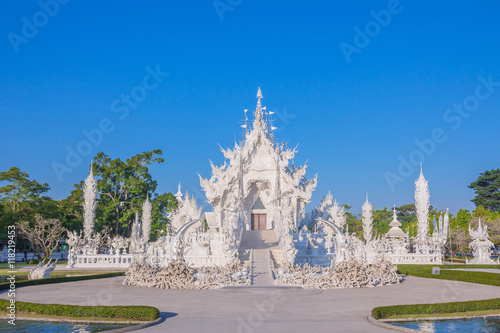 Wat Rong Khun, Chiang Rai province, northern Thailand Magnificently grand white church and reflection in the water. The white temple of Chiang Rai