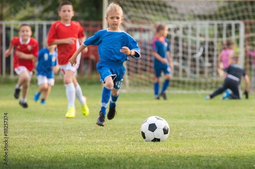 boys kicking football