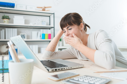 Sleepy woman in the office