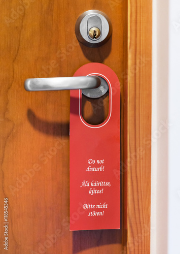 Do not disturb sign hanging on door knob.