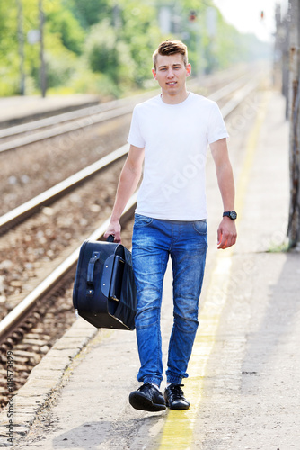 The young man at the railway station.