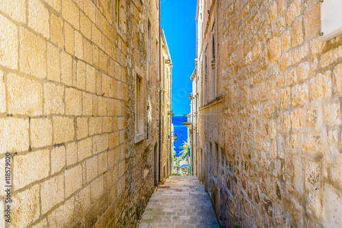 Mediterranean narrow old street. / Mediterranean sgtreetin old city center of town Korcula, Croatia.