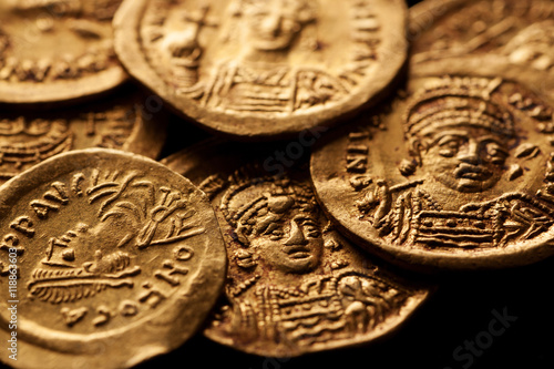 Ancient golden Byzantine coins with emperor portraits