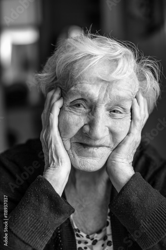 Black and white portrait of an old woman, close-up.