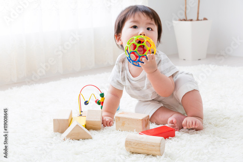 portrait of asian baby playing