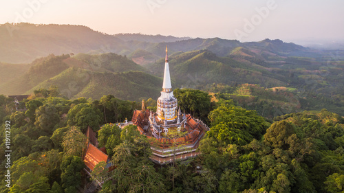 a style of Buddha with a naga over the head at wat Bangreang in PhangNga province.when aerial photo by drone you can see Buddha statue,QuanYin and big pagoda on the hill top 