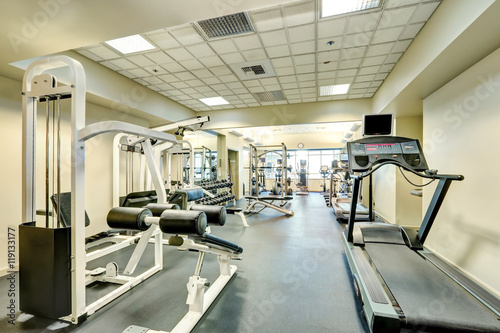 Interior of new modern gym with sport equipment