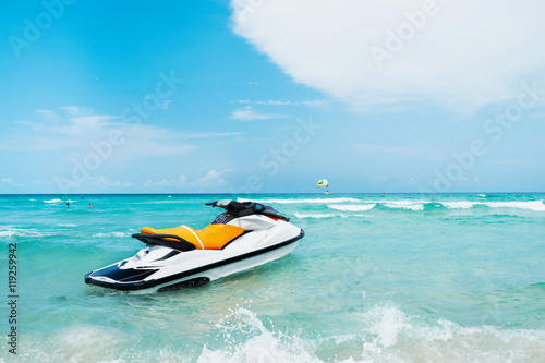 Blue sea and a jet ski floating on the sea, with a blue sky back