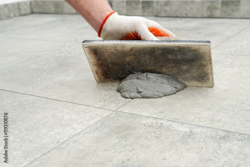 Grouting ceramic tiles.